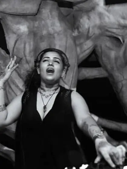 A dramatic black and white shot of me singing along to a track in Goa.