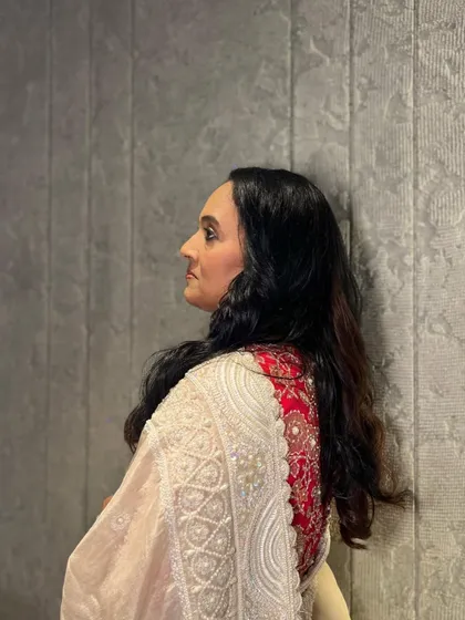 A profile shot of the client with her simple, elegant hairstyle.
