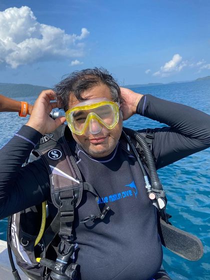 Moments from our Andaman dive trips, showing everything from gearing up at the dive center to relaxing on the boat between dives.