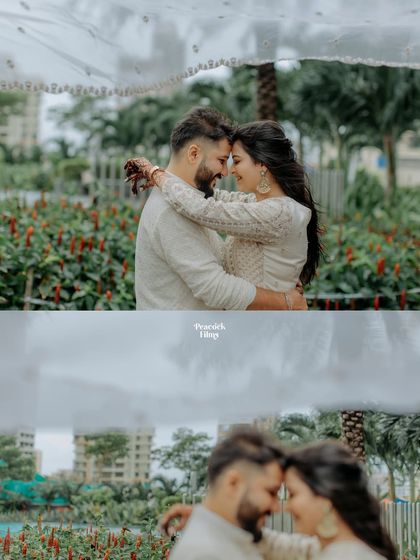 An intimate pre-wedding moment, with the couple sharing a close embrace under a delicate white dupatta, creating a soft and dreamy portrait.
