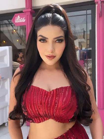 This is the vibe. A snatched, sleek high ponytail that is all about power and glamour. We love this look for a cocktail night or sangeet where you want to own the room.