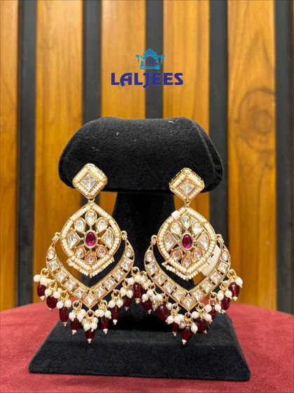 These elegant polki earrings with maroon drops are a versatile choice for any wedding guest or bridesmaid.