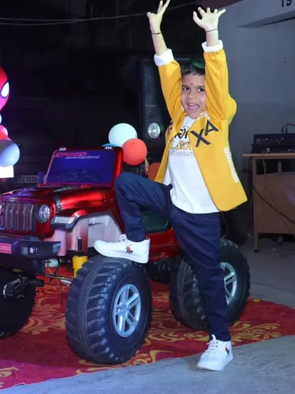 The birthday boy posing with his ride. The mini jeep for the grand entry was a perfect addition to his Spiderman themed party.