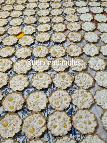 This image provides a glimpse into the scale of my production. Here, a large batch of my lotus urli candles is being prepared, each one handmade with the same attention to detail, ensuring consistency for bulk orders.