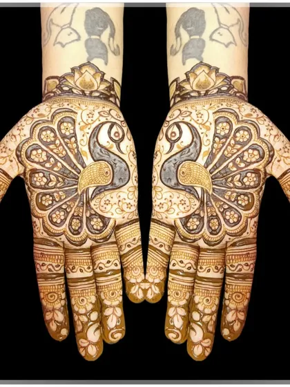 The peacock is a timeless symbol of grace and beauty in mehndi art. Here, I've created a design where two majestic peacocks form the centerpiece, surrounded by delicate floral patterns for an elegant look.