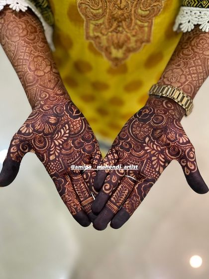 A close-up of the palms, showcasing the deep color of the one-day stain.