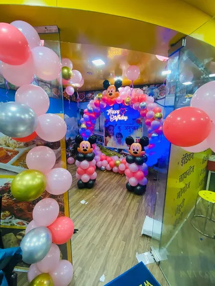 A side view of the restaurant birthday setup, showing how the decorations transform the space.
