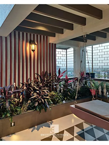I transform outdoor areas into relaxing extensions of the home. This terrace features a comfortable swing, lush planters, and patterned floor tiles, creating a perfect urban oasis for unwinding.