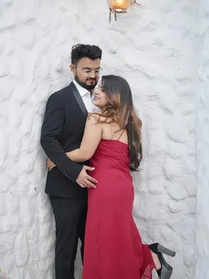 A glamorous pre-wedding look with a red dress. The makeup is bold and confident, perfect for making a statement.