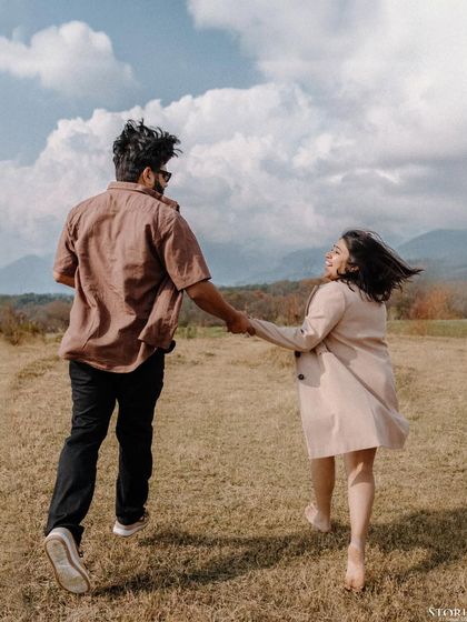 Anuj and Kanika running joyfully through a field in Bir Billing, a moment of pure, carefree love.