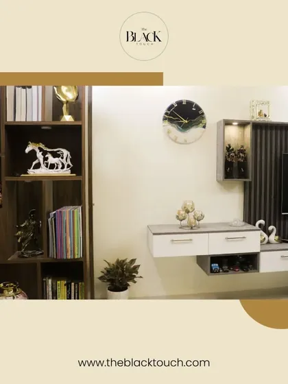 A well-organized TV unit and bookshelf combination. This design provides ample storage and display space while maintaining a clean and modern look.