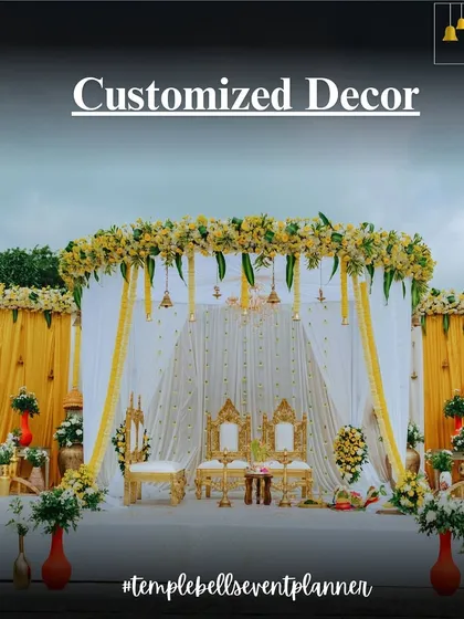 Our customized decor service allows for unique mandap designs, like this one featuring a Ganesha painting as the backdrop, blending art with sacred traditions.