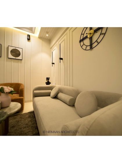 The foyer and living room at our Sushil Advait project. We used a curved sofa and simple, elegant furniture to create a welcoming and uncluttered space that feels both modern and timeless.