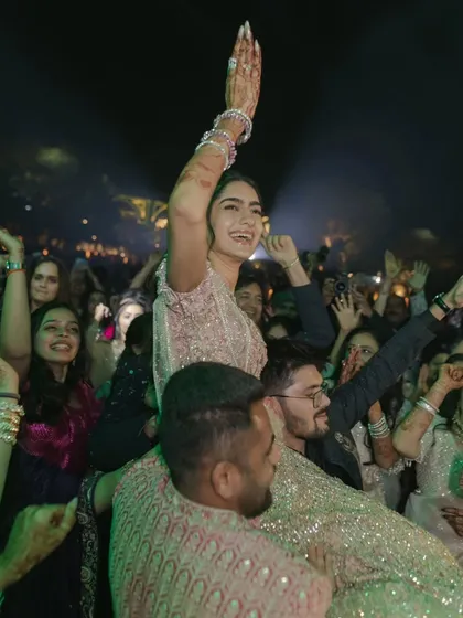 Pure, unadulterated joy! The bride celebrating on the shoulders of her loved ones is what a great party is all about. I aim to create an environment where everyone feels free to celebrate with abandon.