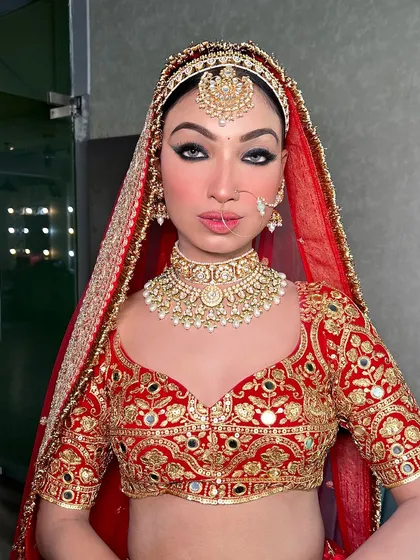 A powerful, direct look from the bride in our red lehenga. This shows how the right outfit and styling can bring out so much confidence.