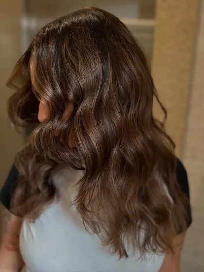 The final result of the "superpower" color, styled into soft, beautiful waves that show off the dimension and shine.