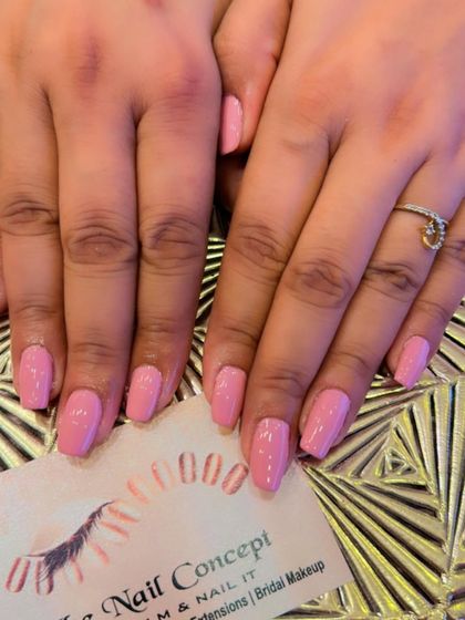 A sweet and simple set of square-shaped nails in a soft, baby pink color. A perfect choice for a clean and feminine look.