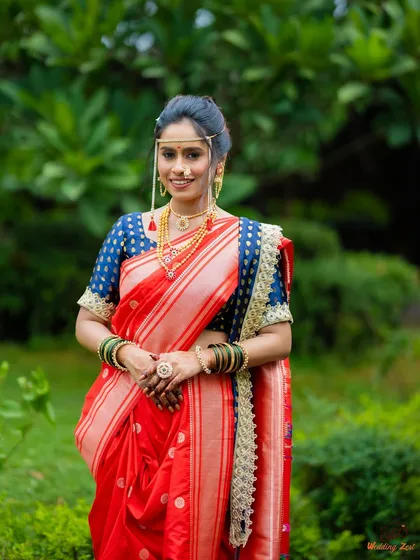 A classic Maharashtrian bride in a radiant red Paithani Nauvari. I styled this entire look, from the precise drape and minimal makeup to the traditional mundavalya and jewelry, ensuring she felt both royal and comfortable on her big day.