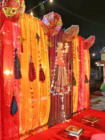 This is a traditional Rajasthani-themed baby shower decoration. I used vibrant bandhani drapes, puppets (kathputli), and decorative umbrellas to create a colorful and authentic backdrop for the ceremony.