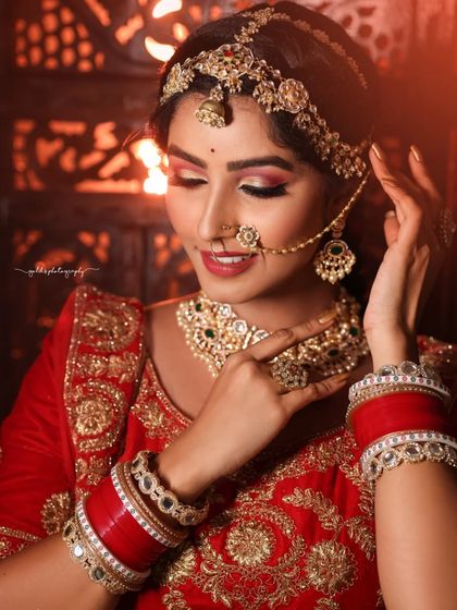 A series of portraits showcasing a model in a heavily embroidered red bridal lehenga. I focused on capturing the intricate details of the outfit and the flawless bridal makeup, presenting a look of regal elegance.