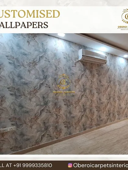 A full wall covered in our subtle, textured wallpaper that mimics the look of polished stone or marble.