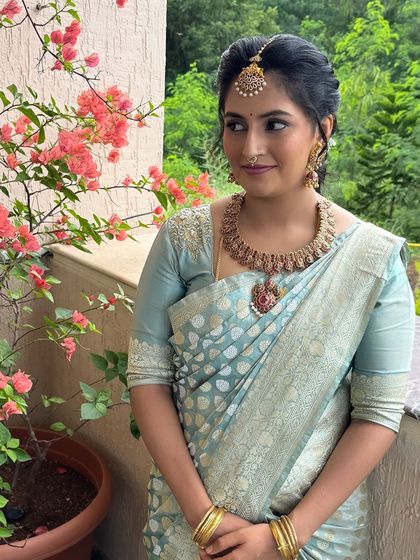 Jahnavi looking serene and beautiful against a natural backdrop. This look is perfect for a new mom who wants to feel special.