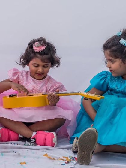 Another view of the sisters playing together, showcasing the comfort and style of their dresses. My designs are made for making happy memories.
