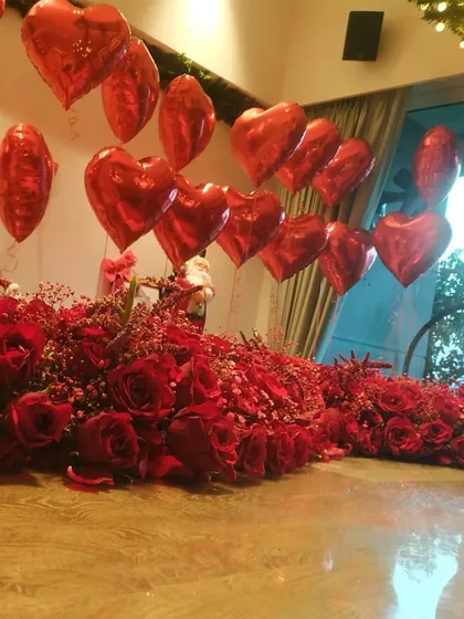 A close-up of the lush red rose table runner, a key element in creating a luxurious and romantic Valentine's Day ambiance.