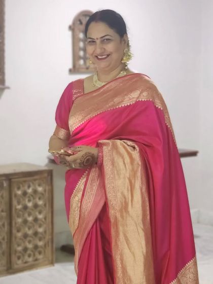 The mother of the bride and her friends, all looking elegant in traditional sarees for the wedding festivities.