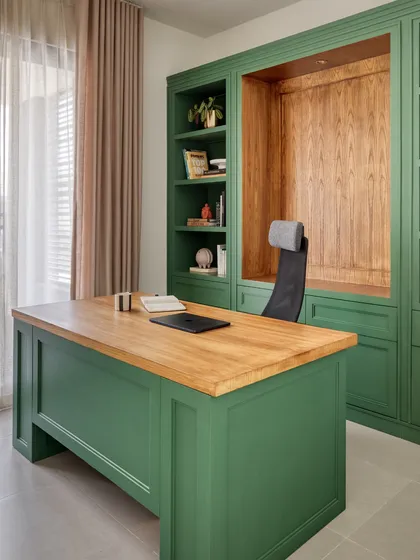 A home office should be both functional and inspiring. For this study in Dubai, we used a bold bottle green, a color significant to our clients, paired with warm oak wood to create a space that feels grounding, elegant, and conducive to focus.