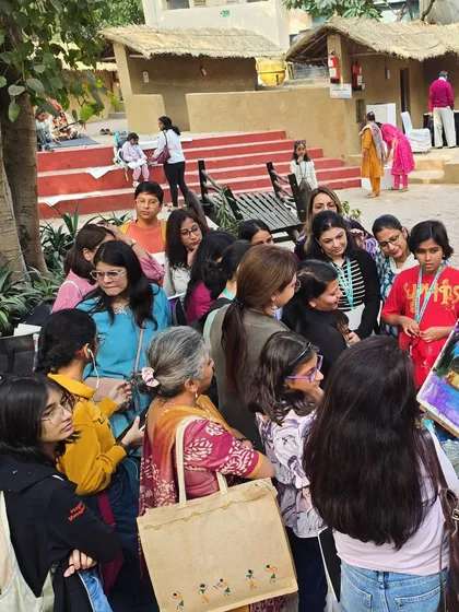 Students gather to watch an instructor's demonstration, a key part of our hands-on approach to teaching art, whether indoors or out.