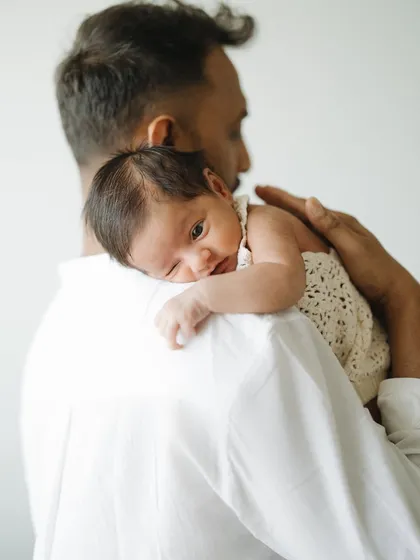 A father's gentle hold. This is my husband Richard with our son Caden. I love capturing these quiet, tender moments that show the powerful bond between a dad and his kulanthai.