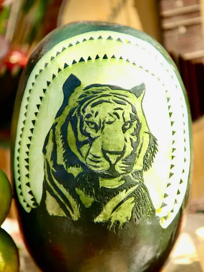 Another example of my team's artistic talent, this is a tiger's face intricately carved into a watermelon. These creative details make the food display a major talking point.