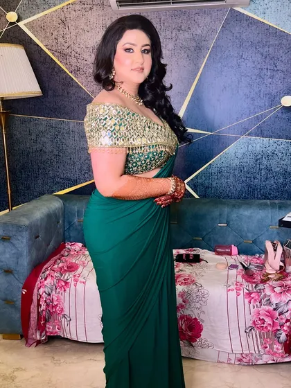 A side view of our stunning cocktail bride, showing off her elegant saree and the beautiful waves in her hair.