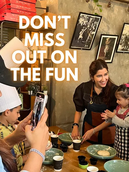 The fun isn't just for adults. This shot from one of my Mom and Kids workshops captures the joy of a little chef learning to clap the flour off her hands while her mom captures the memory.