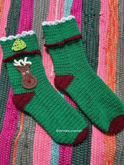 Another view of our handmade crochet Christmas stockings, ready to be filled with holiday treats.