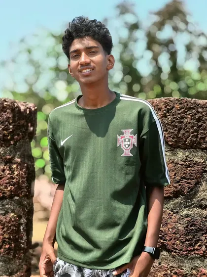 A casual outdoor portrait of a young man, part of the Oppo Reno 11 Series showcase. This demonstrates the camera's versatility in capturing everyday people in natural environments.