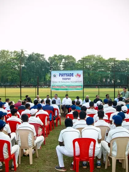 A view from behind the seated young cricketers, all in their whites, as they listen to the speakers at the U-16 Payyade Trophy prize distribution ceremony.