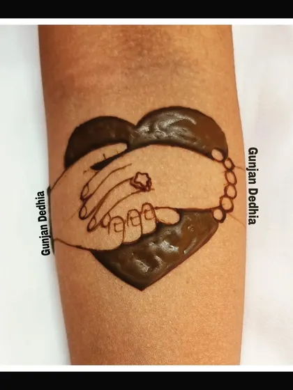 The start of a beautiful engagement mehendi. This simple heart and hands design is a popular choice to symbolize a new beginning.
