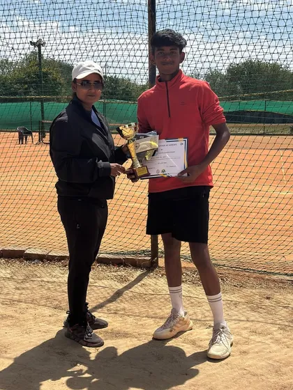 Presenting the winner's trophy to Harshit Yadav at our monthly tournament. These events are a key part of our program, fostering a competitive spirit among our players.