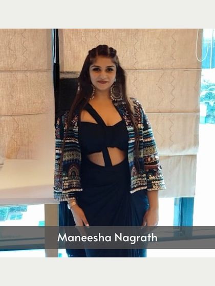 A black cutout dress styled with an embellished jacket, showing how layering can completely change an outfit.