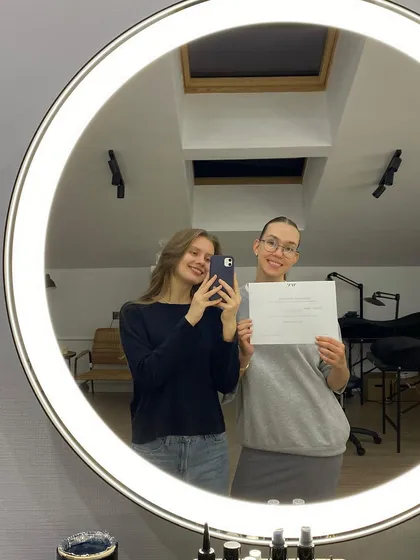 A happy student and her instructor taking a celebratory selfie after completing a training course. We build strong, supportive relationships with our students.