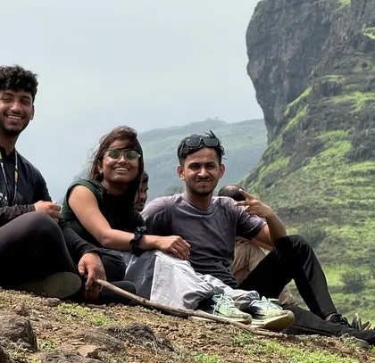 Taking a break and enjoying the view during the Aadrai Jungle trek in Maharashtra.