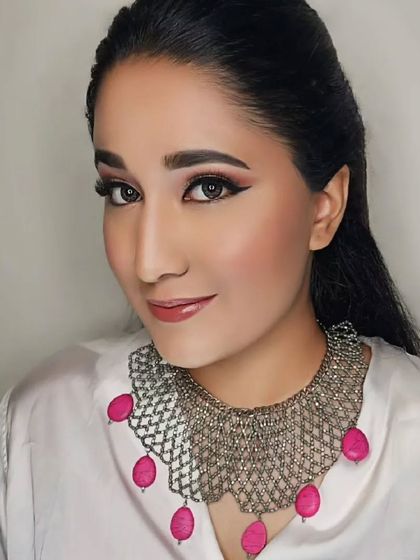 A dewy soft glam look with a focus on winged eyeliner and a pink lip. This look is glamorous and modern, perfect for a party or special celebration.