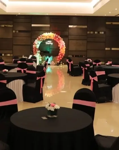 A wider view of the banquet hall, showing how the main backdrop serves as a focal point for the entire room's decor.