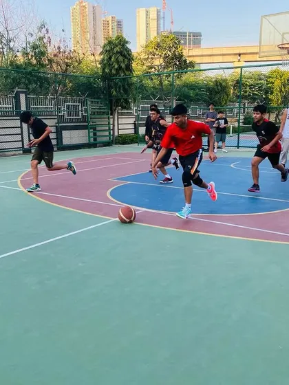 Players run a drill, focusing on speed and ball control.