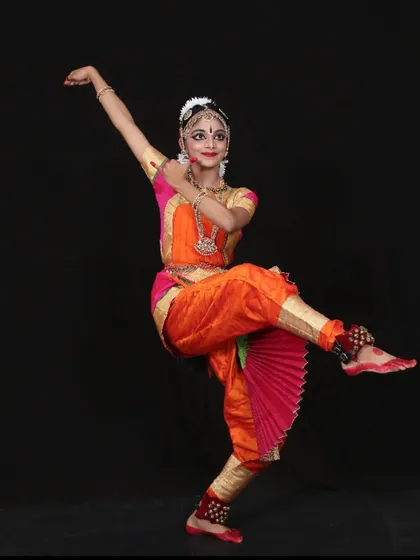 This is Athmika, who completed her Arangetram last year. She continues to hone her skills and also helps with our beginner students, which is a wonderful way to give back.