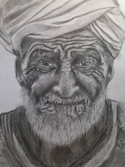 A completed portrait of a man with a turban, created using charcoal and pencil shading techniques. This piece focuses on capturing the deep wrinkles and textures that tell a story.