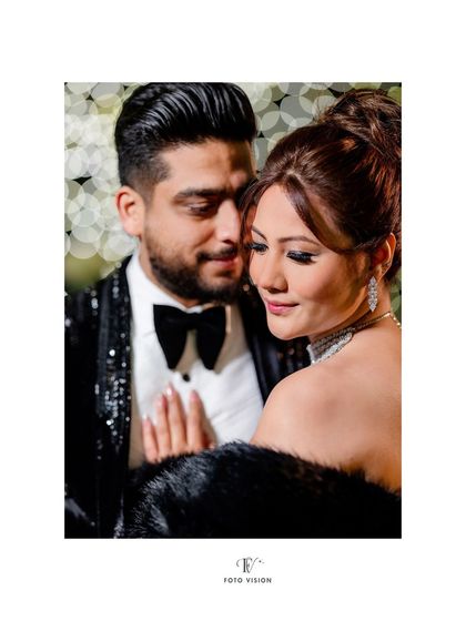 A close up portrait emphasizing the bride's flawless makeup and the couple's gentle interaction. We work to capture both glamour and intimacy.