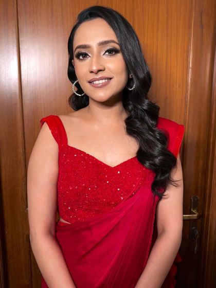 The prettiest bride-to-be, ready for a Diwali party. I gave her a glamorous look with a smokey eye and a bold red saree.